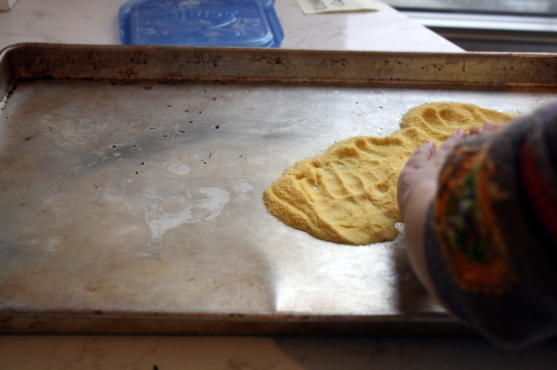 Sprinkle some corn meal on your baking sheet to prevent sticking