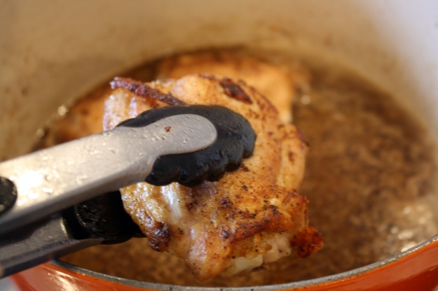 Return chicken pieces to the pot